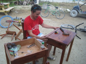 Danny repairing school furniture