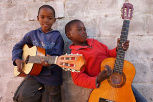 Students playing guitar at Ntonga