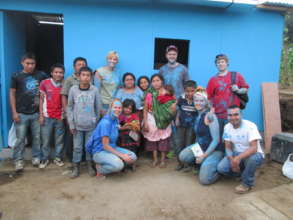 Tomas' Family & Volunteers with Their New Home