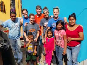 Eslyn's family and volunteers with the new home