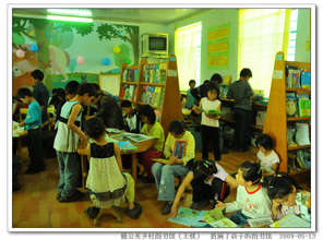 Children reading in our library