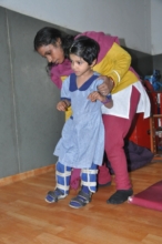 SIS child getting therapy and  mobility aids.JPG