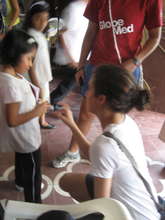 GROW team members with young girl at workshop