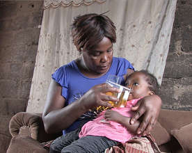 Margret gives Rabecca ORS using Kit Yamoyo
