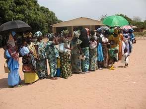 Women Standing in Line to Receive Medical Care