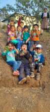 Children of Xesuj, with their radish crop