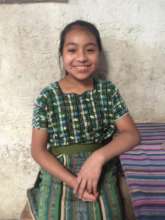 With a cheering smile, she is Imelda.