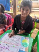 She is Beatriz, who can now write her name