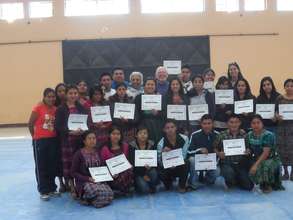 Teachers receiving diplomas