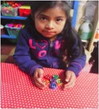 Girl using literacy materials