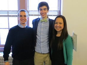 Kyle (left) and Susan (right) pose with a student