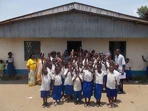 Kids in Kiliba proudly display their writing tools