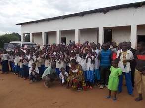 Rwenena kids celebrating with pencils & pens