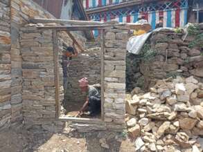 HHC supevisor measuring the size of the toilet