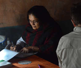 Midwife updating records in HHC Shertung clinic