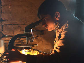 Pradeep checks a blood sample