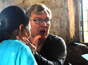 HHC Dr. David Johnson examines a patient in Ilam