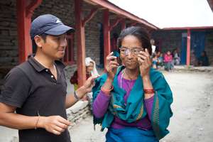 Patient trying on eyeglasses, Lapa Village