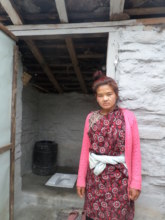 Proud Toilet Recipient and Her Toilet in Sertung
