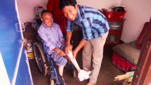 HHC health staff, Phe Tamang, works with Chitra