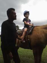 Sergei helps a young rider