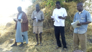 KOSGUELBE group leaders reading pyrolysis manual.