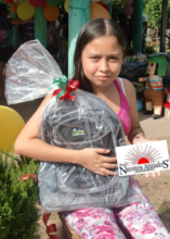Melany recieving her new backpack for school!