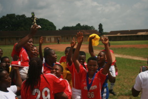 Kumba girls raising the Super Cup!