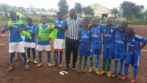 Teams stand with referee before kick off!