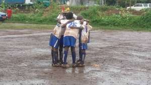 Team huddle with a game plan and prayer