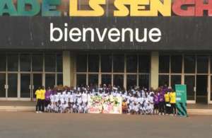 Girls and coaches outside the national stadium.