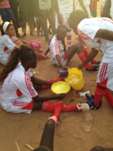 Kaffrine players share water during a hot game.