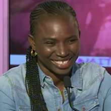 Seyni gives a television interview.