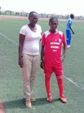 Seyni and player at a girls' soccer camp.