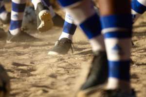 Girls play in their new cleats