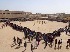 A crowd gathers to watch the girls play.
