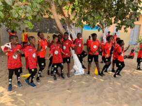 Girls play soccer at their elementary school