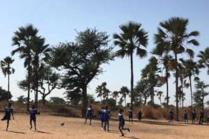 Girls play a soccer tournament game in Thies