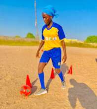 Girl in Kaolack, Senegal practicing dribbling