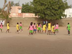 Girls play- in Senegal, soccer is a sand sport.