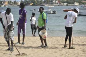 Set Setal: Young women players clean Ngor beach.