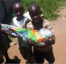 Food donation by Hon. Ms. Rozaah Buyu