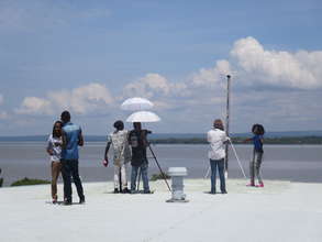 Nahna (r) and video crew at Lake Victoria, Kisumu