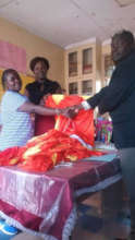 Coach Carina gives uniforms to Shaurimoyo School