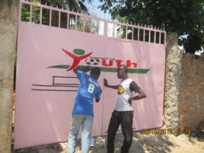 Our logo goes up on gate of the new office