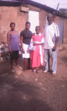 Oballah gives young girl school materials