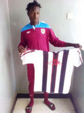 Vicky with new uniform from Musa Otieno