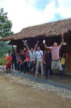 Foundation University work crew jump for joy