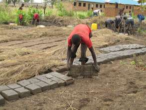 Pouring out molded brick to dry