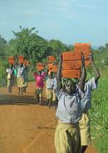 Students ferrying bricks for their school June2014